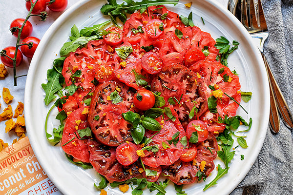 Rawcology Inc | Simple Herb Tomato and Olive Summer Salad