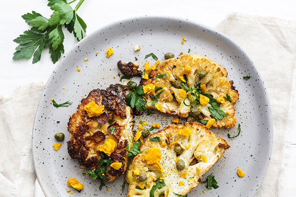 Rawcology Inc | Cauliflower Steaks with Lemon Zest + Capers